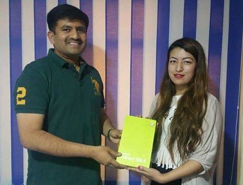CEO of MEX Nepal, Mr. Jitesh Surendran, giving away the Samsung Tab E to the winner of the MEX Selfie Contest, Ms. Barsha Maharjan